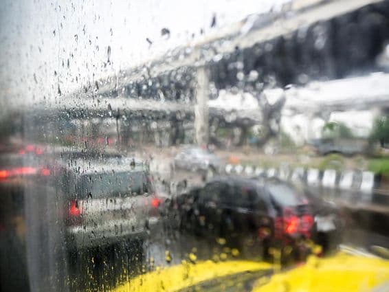 Traffic on a rainy day through a car window