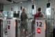 Air travelers passing through passport control checkpoints