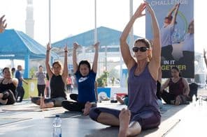 Women doing aerobics and yoga during Dubai Fitness Challenge.