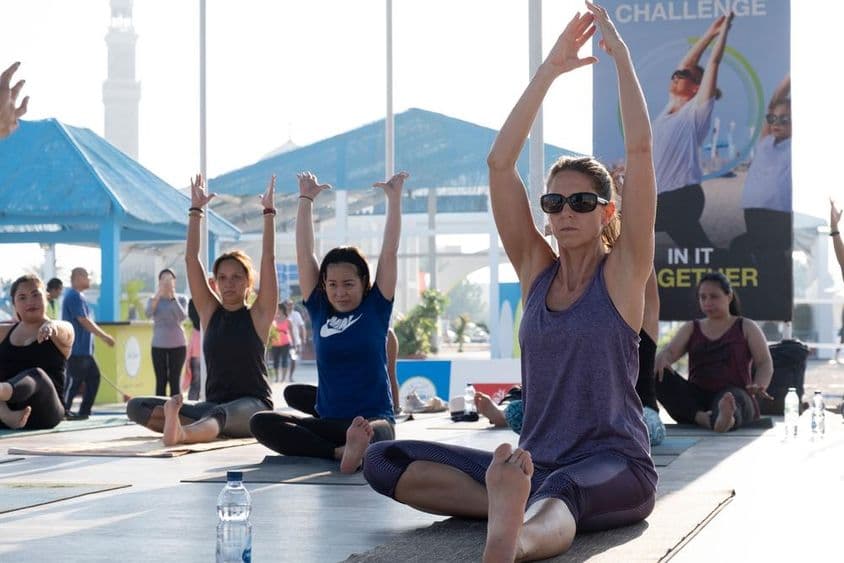 Women doing aerobics and yoga during Dubai Fitness Challenge.