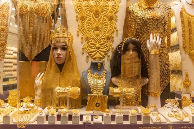 Image of women's jewelry in a display at the Dubai Gold Souk market.