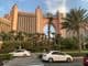 Car traffic in front of the famous luxury Atlantis Hotel on Palm Jumeirah island.