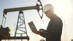 Oil pump, Engineer working with a laptop