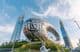 Saluting with three fingers alongside the Museum of the Future in Dubai