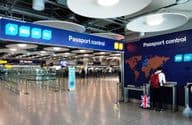 The United Kingdom and European travelers using separate passport control and immigration lanes.
