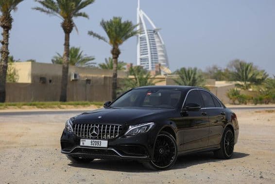 Mercedes Benz C300 parked outdoors in the city of Dubai.