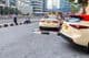 A group of taxi drivers waiting for passengers in front of a Dubai hotel.