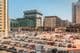 Large, crowded outdoor parking lot with hundreds of cars
