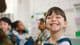 Smiling female elementary school student.
