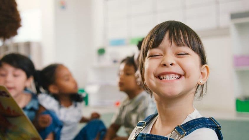 Smiling female elementary school student.
