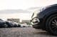 Cars parked in a gravel parking lot