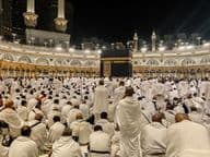 Nighttime pilgrims gather around the Kaaba