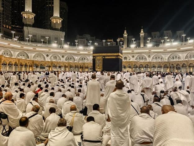 Nighttime pilgrims gather around the Kaaba