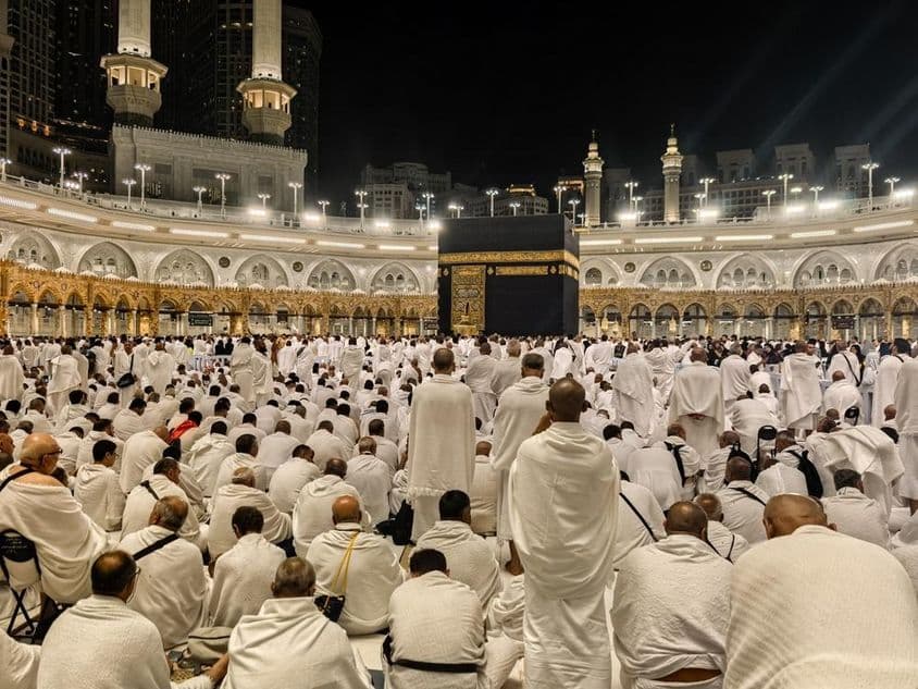 Nighttime pilgrims gather around the Kaaba