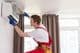Removing an air conditioner air filter