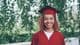 happy graduate in red gown