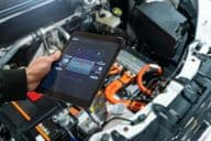 Checking an electric car battery at a service center