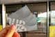 A woman holding two NOL metro cards in her hand