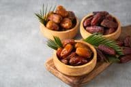 Dried date fruit on a plate.